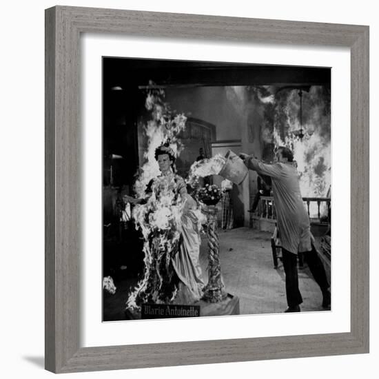 Actor Vincent Price Putting Out Fire in Film "House of Wax"-J^ R^ Eyerman-Framed Premium Photographic Print