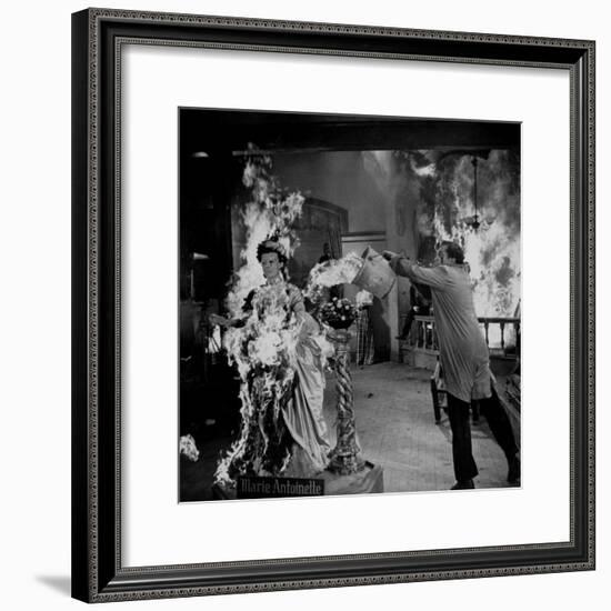 Actor Vincent Price Putting Out Fire in Film "House of Wax"-J^ R^ Eyerman-Framed Premium Photographic Print