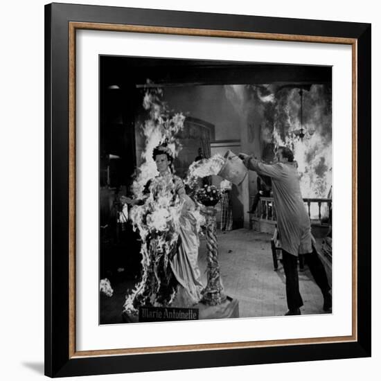 Actor Vincent Price Putting Out Fire in Film "House of Wax"-J^ R^ Eyerman-Framed Premium Photographic Print