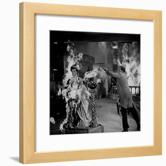 Actor Vincent Price Putting Out Fire in Film "House of Wax"-J^ R^ Eyerman-Framed Premium Photographic Print