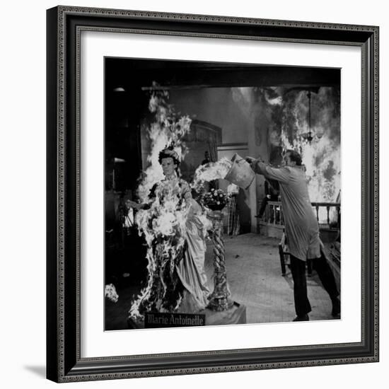 Actor Vincent Price Putting Out Fire in Film "House of Wax"-J^ R^ Eyerman-Framed Premium Photographic Print