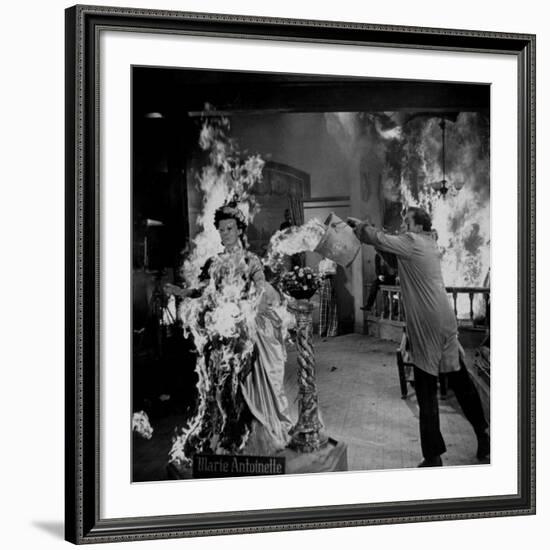 Actor Vincent Price Putting Out Fire in Film "House of Wax"-J^ R^ Eyerman-Framed Premium Photographic Print