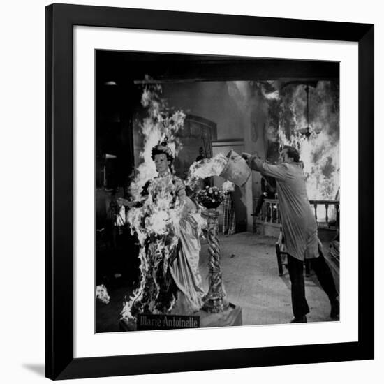 Actor Vincent Price Putting Out Fire in Film "House of Wax"-J^ R^ Eyerman-Framed Premium Photographic Print