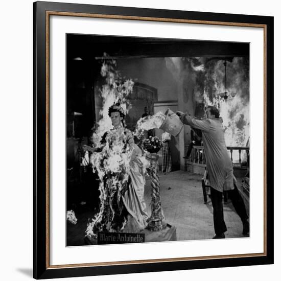 Actor Vincent Price Putting Out Fire in Film "House of Wax"-J^ R^ Eyerman-Framed Premium Photographic Print