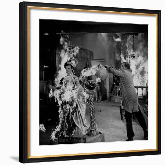 Actor Vincent Price Putting Out Fire in Film "House of Wax"-J^ R^ Eyerman-Framed Premium Photographic Print