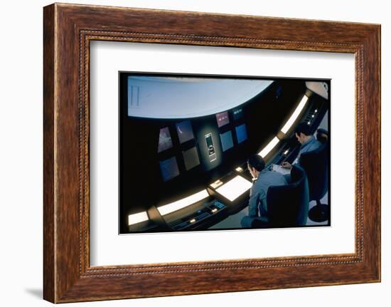 Actors Keir Dullea and Gray Lockwood Sitting at Console in Scene of "2001: A Space Odyssey"-Dmitri Kessel-Framed Photographic Print