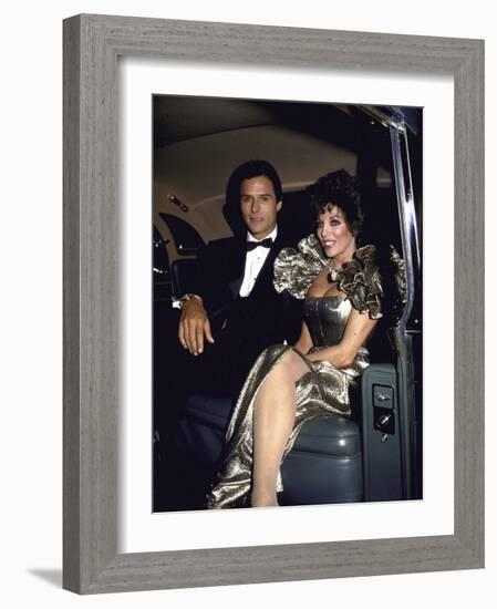 Actors Michael Nader and Joan Collins Sitting in a Car-John Paschal-Framed Premium Photographic Print