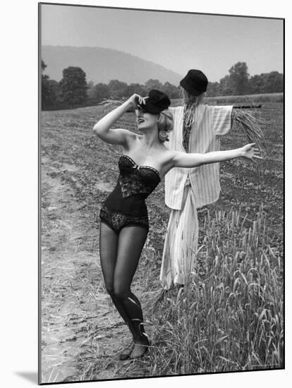 Actress and Dancer Julie Newmar Warming Up for Her Devil's Role in the Musical "Damn Yankees"-Nina Leen-Mounted Premium Photographic Print