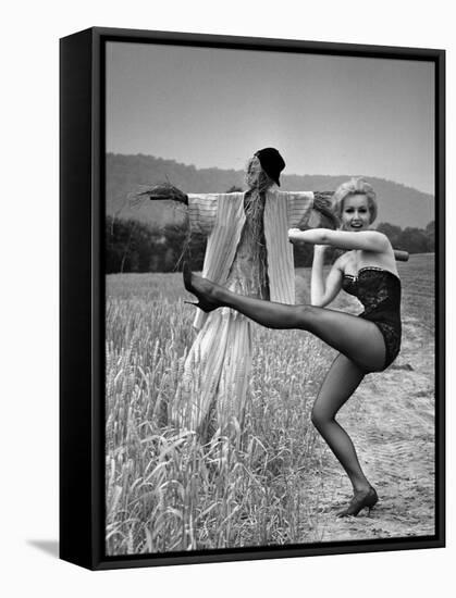 Actress and Dancer Julie Newmar Warming Up for Her Devil's Role in the Musical "Damn Yankees"-Nina Leen-Framed Premier Image Canvas