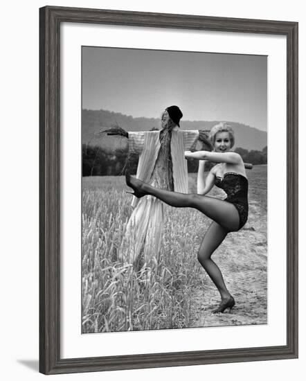 Actress and Dancer Julie Newmar Warming Up for Her Devil's Role in the Musical "Damn Yankees"-Nina Leen-Framed Premium Photographic Print