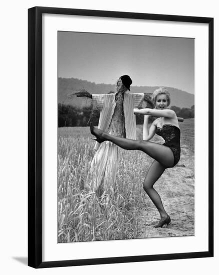 Actress and Dancer Julie Newmar Warming Up for Her Devil's Role in the Musical "Damn Yankees"-Nina Leen-Framed Premium Photographic Print