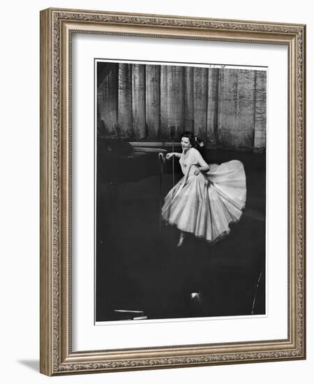 Actress and Singer Judy Garland Twirling Into a Dance Step During a Performance at the Palladium-Cornell Capa-Framed Photographic Print