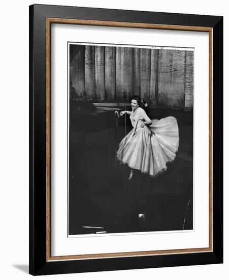 Actress and Singer Judy Garland Twirling Into a Dance Step During a Performance at the Palladium-Cornell Capa-Framed Photographic Print