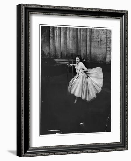 Actress and Singer Judy Garland Twirling Into a Dance Step During a Performance at the Palladium-Cornell Capa-Framed Photographic Print