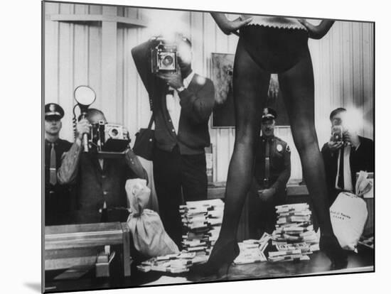 Actress Angie Dickinson's Lower Half Straddling a Million Dollars in Fake Money-John Dominis-Mounted Premium Photographic Print