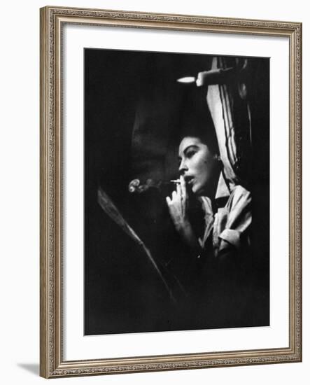 Actress Ava Gardner Smoking a Cigarette in a Scene from the Film "Mogambo"-Peter Stackpole-Framed Premium Photographic Print