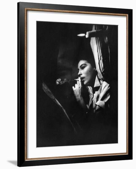 Actress Ava Gardner Smoking a Cigarette in a Scene from the Film "Mogambo"-Peter Stackpole-Framed Premium Photographic Print