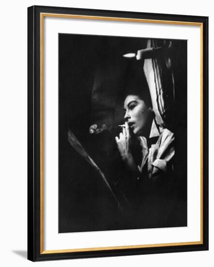 Actress Ava Gardner Smoking a Cigarette in a Scene from the Film "Mogambo"-Peter Stackpole-Framed Premium Photographic Print