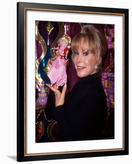 Actress Barbara Eden Holding Up Jeannie Doll-Dave Allocca-Framed Premium Photographic Print