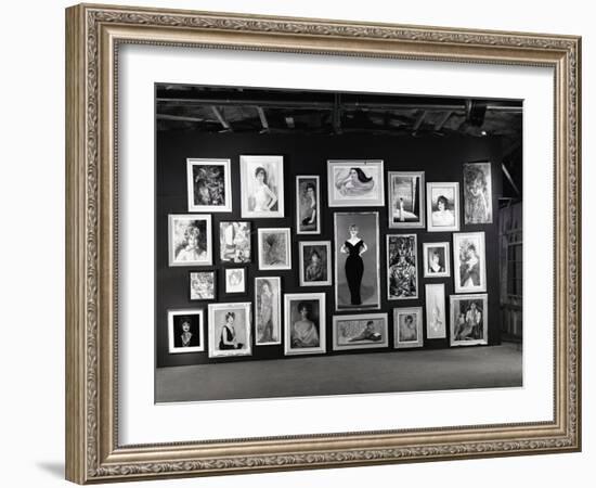 Actress Barbara Rush Posing in a Frame Cut-Out on a Wall Full of Paintings of Herself, 1960-Ralph Crane-Framed Photographic Print