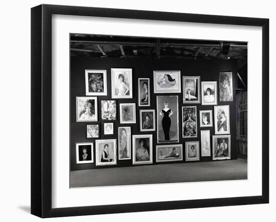 Actress Barbara Rush Posing in a Frame Cut-Out on a Wall Full of Paintings of Herself, 1960-Ralph Crane-Framed Photographic Print