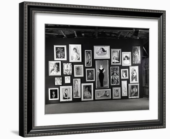 Actress Barbara Rush Posing in a Frame Cut-Out on a Wall Full of Paintings of Herself, 1960-Ralph Crane-Framed Photographic Print