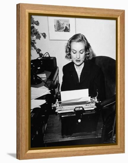 Actress Carole Lombard Typing While Holding Pencil Firmly in Her Mouth-Rex Hardy Jr.-Framed Premier Image Canvas