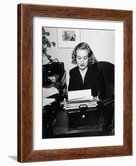 Actress Carole Lombard Typing While Holding Pencil Firmly in Her Mouth-Rex Hardy Jr.-Framed Premium Photographic Print