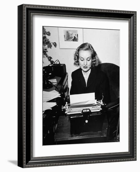 Actress Carole Lombard Typing While Holding Pencil Firmly in Her Mouth-Rex Hardy Jr.-Framed Premium Photographic Print