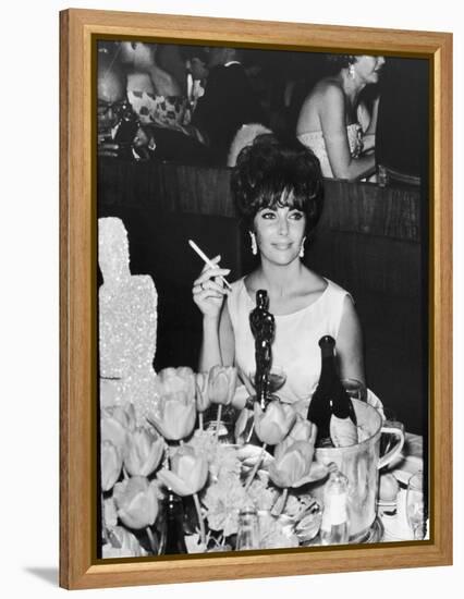 Actress Elizabeth Taylor at Hollywood Party After Winning Oscar, Which is on Table in Front of Her-Allan Grant-Framed Premier Image Canvas