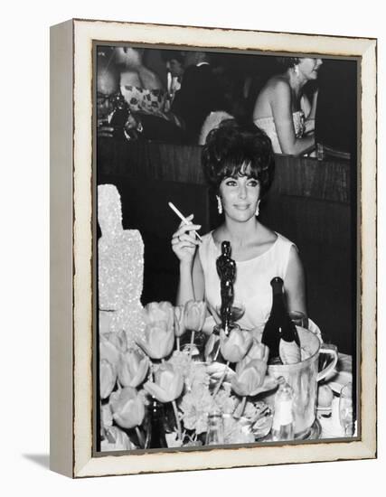 Actress Elizabeth Taylor at Hollywood Party After Winning Oscar, Which is on Table in Front of Her-Allan Grant-Framed Premier Image Canvas