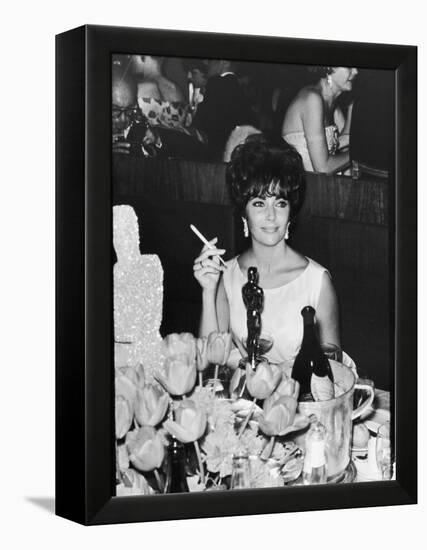Actress Elizabeth Taylor at Hollywood Party After Winning Oscar, Which is on Table in Front of Her-Allan Grant-Framed Premier Image Canvas