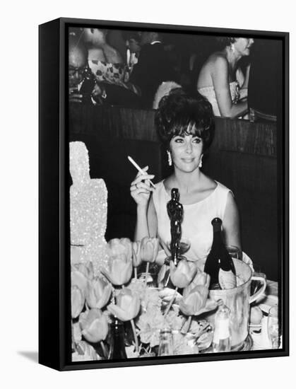 Actress Elizabeth Taylor at Hollywood Party After Winning Oscar, Which is on Table in Front of Her-Allan Grant-Framed Premier Image Canvas