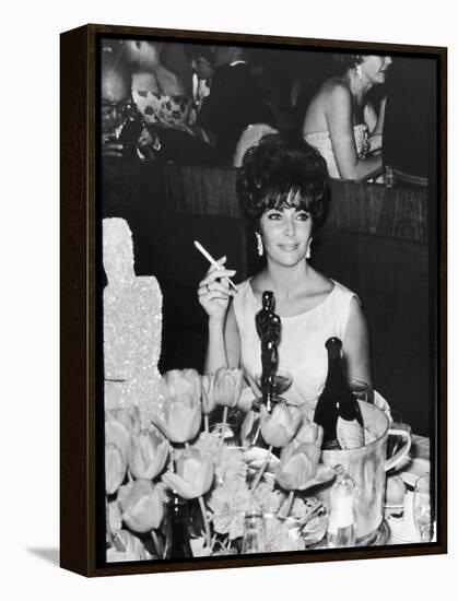 Actress Elizabeth Taylor at Hollywood Party After Winning Oscar, Which is on Table in Front of Her-Allan Grant-Framed Premier Image Canvas