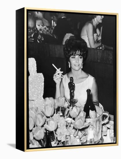 Actress Elizabeth Taylor at Hollywood Party After Winning Oscar, Which is on Table in Front of Her-Allan Grant-Framed Premier Image Canvas