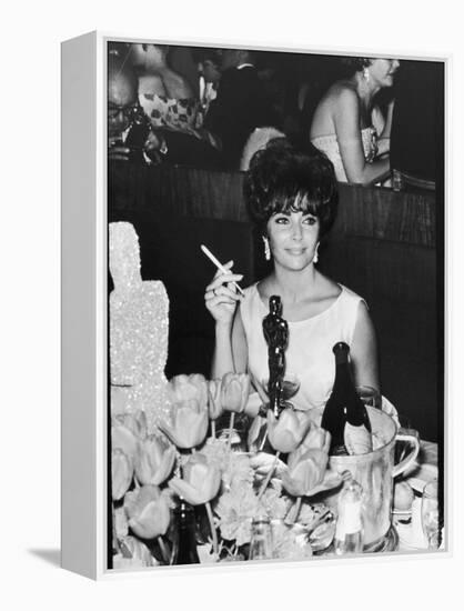 Actress Elizabeth Taylor at Hollywood Party After Winning Oscar, Which is on Table in Front of Her-Allan Grant-Framed Premier Image Canvas