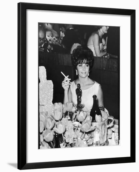 Actress Elizabeth Taylor at Hollywood Party After Winning Oscar, Which is on Table in Front of Her-Allan Grant-Framed Premium Photographic Print