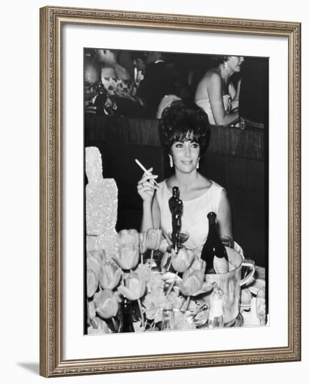 Actress Elizabeth Taylor at Hollywood Party After Winning Oscar, Which is on Table in Front of Her-Allan Grant-Framed Premium Photographic Print