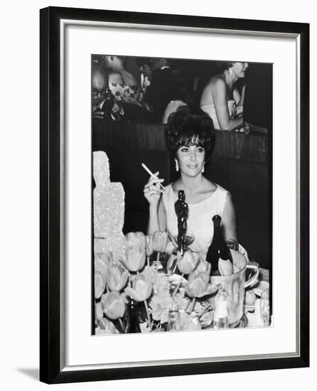 Actress Elizabeth Taylor at Hollywood Party After Winning Oscar, Which is on Table in Front of Her-Allan Grant-Framed Premium Photographic Print