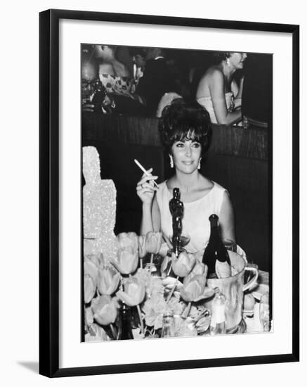 Actress Elizabeth Taylor at Hollywood Party After Winning Oscar, Which is on Table in Front of Her-Allan Grant-Framed Premium Photographic Print