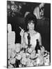 Actress Elizabeth Taylor at Hollywood Party After Winning Oscar, Which is on Table in Front of Her-Allan Grant-Mounted Premium Photographic Print