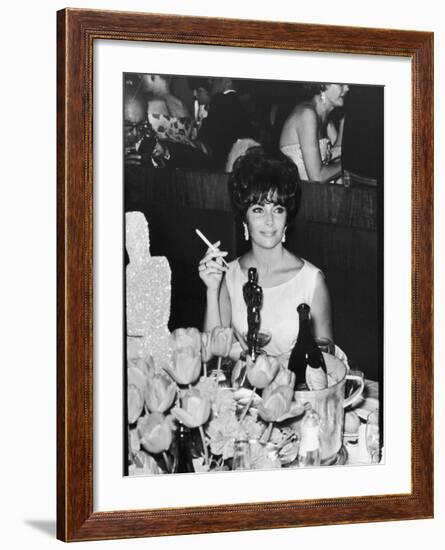 Actress Elizabeth Taylor at Hollywood Party After Winning Oscar, Which is on Table in Front of Her-Allan Grant-Framed Premium Photographic Print