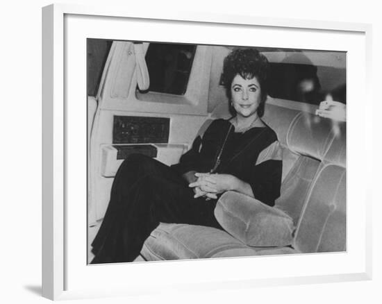 Actress Elizabeth Taylor Sitting in the Back of a Limo-David Mcgough-Framed Premium Photographic Print