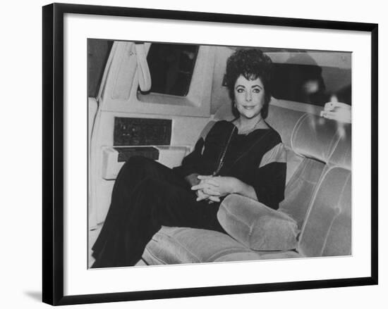 Actress Elizabeth Taylor Sitting in the Back of a Limo-David Mcgough-Framed Premium Photographic Print