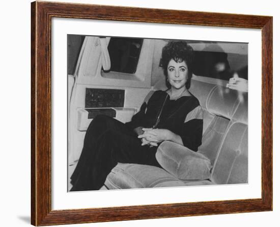 Actress Elizabeth Taylor Sitting in the Back of a Limo-David Mcgough-Framed Premium Photographic Print