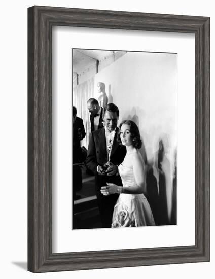 Actress Gene Simmons and Cary Grant Backstage at the 30th Academy Awards, 1958-Ralph Crane-Framed Photographic Print