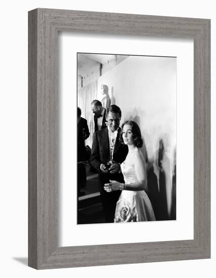 Actress Gene Simmons and Cary Grant Backstage at the 30th Academy Awards, 1958-Ralph Crane-Framed Photographic Print