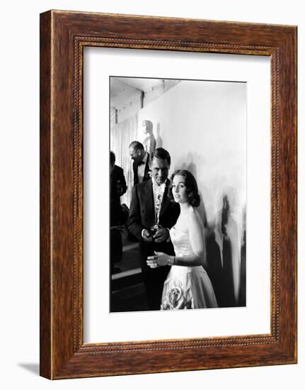 Actress Gene Simmons and Cary Grant Backstage at the 30th Academy Awards, 1958-Ralph Crane-Framed Photographic Print