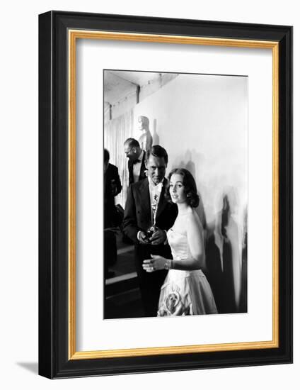 Actress Gene Simmons and Cary Grant Backstage at the 30th Academy Awards, 1958-Ralph Crane-Framed Photographic Print