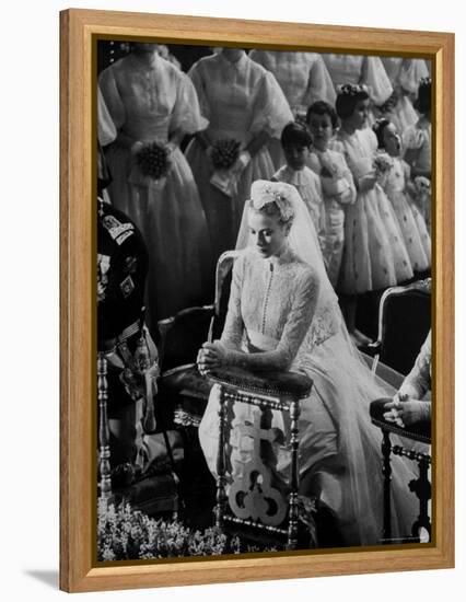 Actress Grace Kelly in Gorgeous Wedding Gown Praying During Her Wedding to Prince Rainier-Thomas D^ Mcavoy-Framed Premier Image Canvas